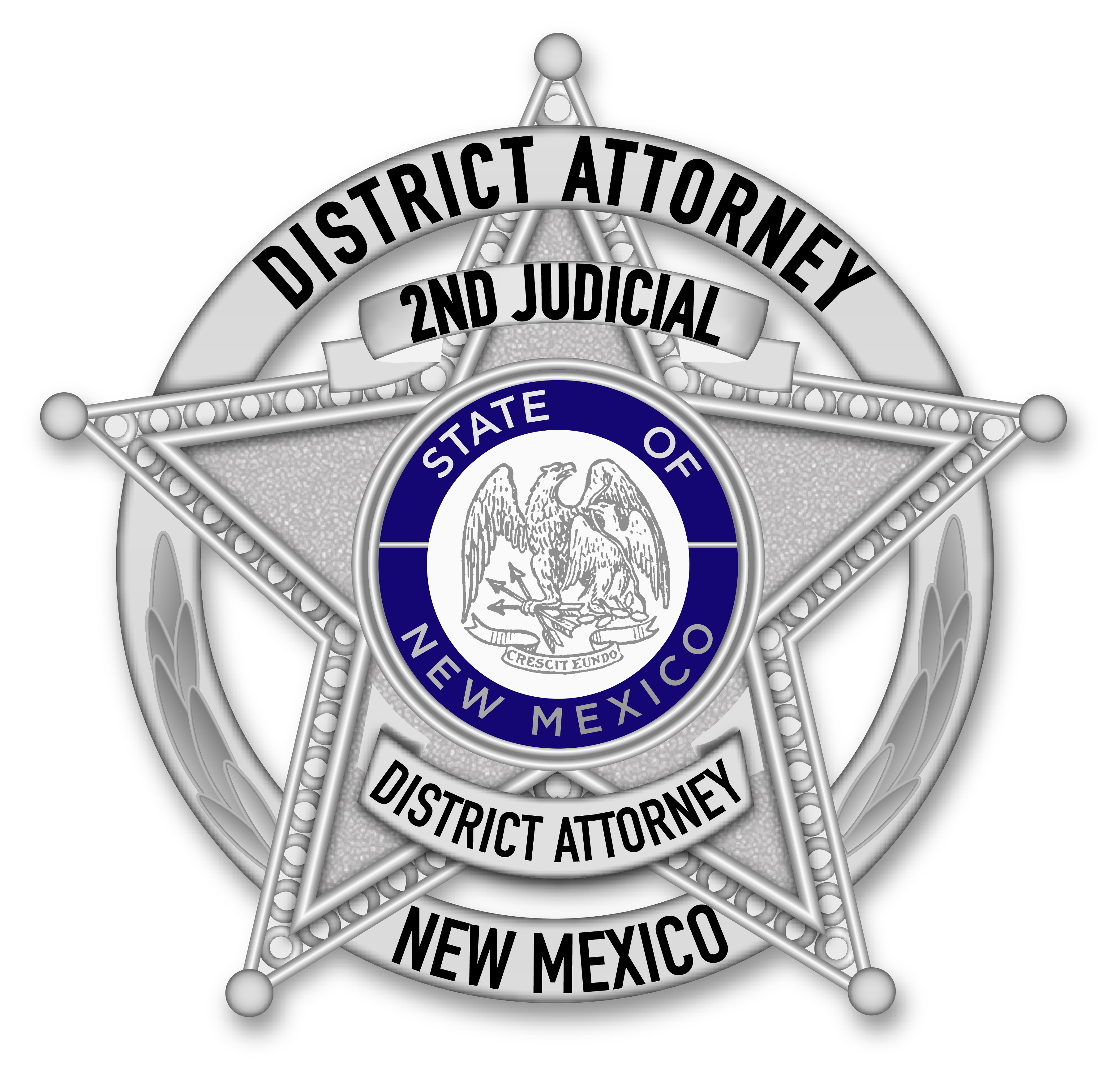 A badge with the New Mexico crest in the middle of it.
